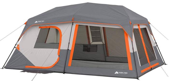 https://familycamptents.com/wp-content/uploads/2019/11/Ozark-Trail-Instant-Cabin-Tent-with-Built-in-Cabin-Lights-view-with-the-fly.jpg