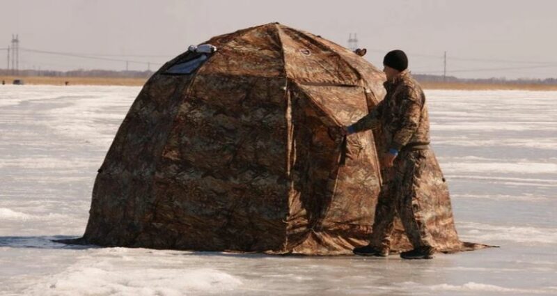 The UP-2 tent on a frozen lake. Observe the height.