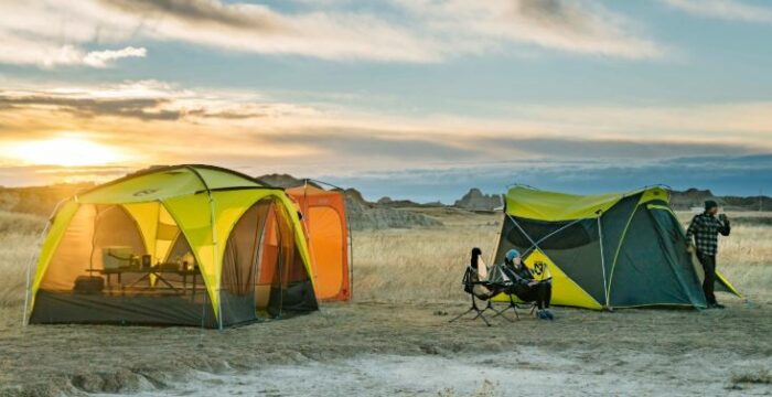 The screen house used next to a family camping tent from the same brand.