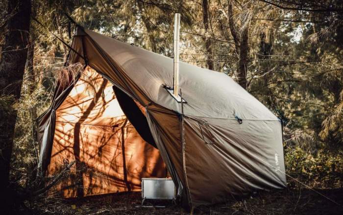 Tent with outlet stove pipe hole